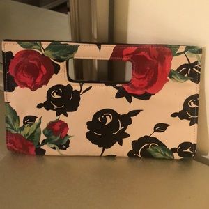 Floral clutch purse with handle.